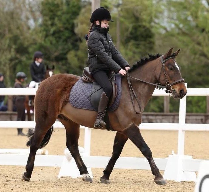 Young rider competing in a dressage class
